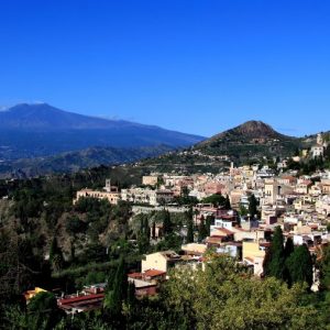 9 small charming towns - Taormina with Etna in the background Image by John Menard via Flickr.com under creative commons license