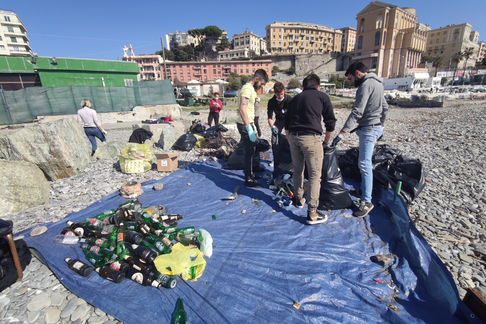 Government says no to plastic tax. Cleaning beach in Genoa of rubbish Editorial credit: Andrea Izzotti / Shutterstock.com