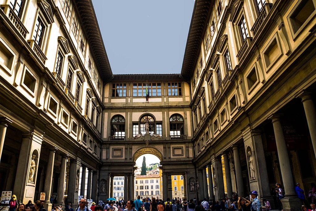 Uffizi Gallery outside - two women pose in skimpy clothes there