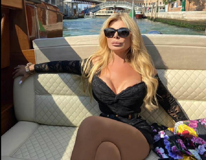 'Lady Oil' on boat in Venice. She was jailed for mafai association.