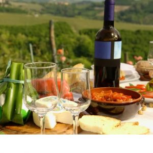 Institute for Wine, Diet and Health introduced in Italy Institue for Wine, Diet and Health promotes mediterranean diet pictured. red wine, fruits, veg, on picnic table