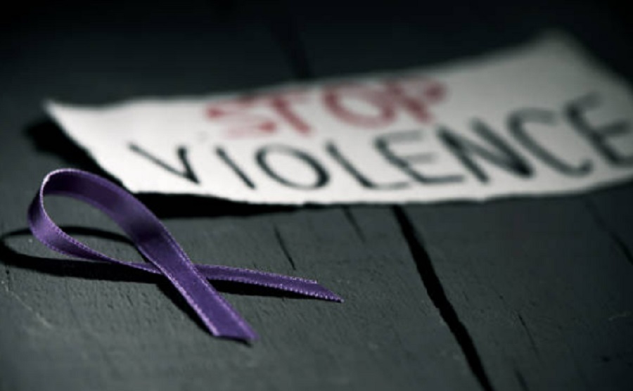 Purple ribbon and stop violence message - Italian government to push through gender violence bill following