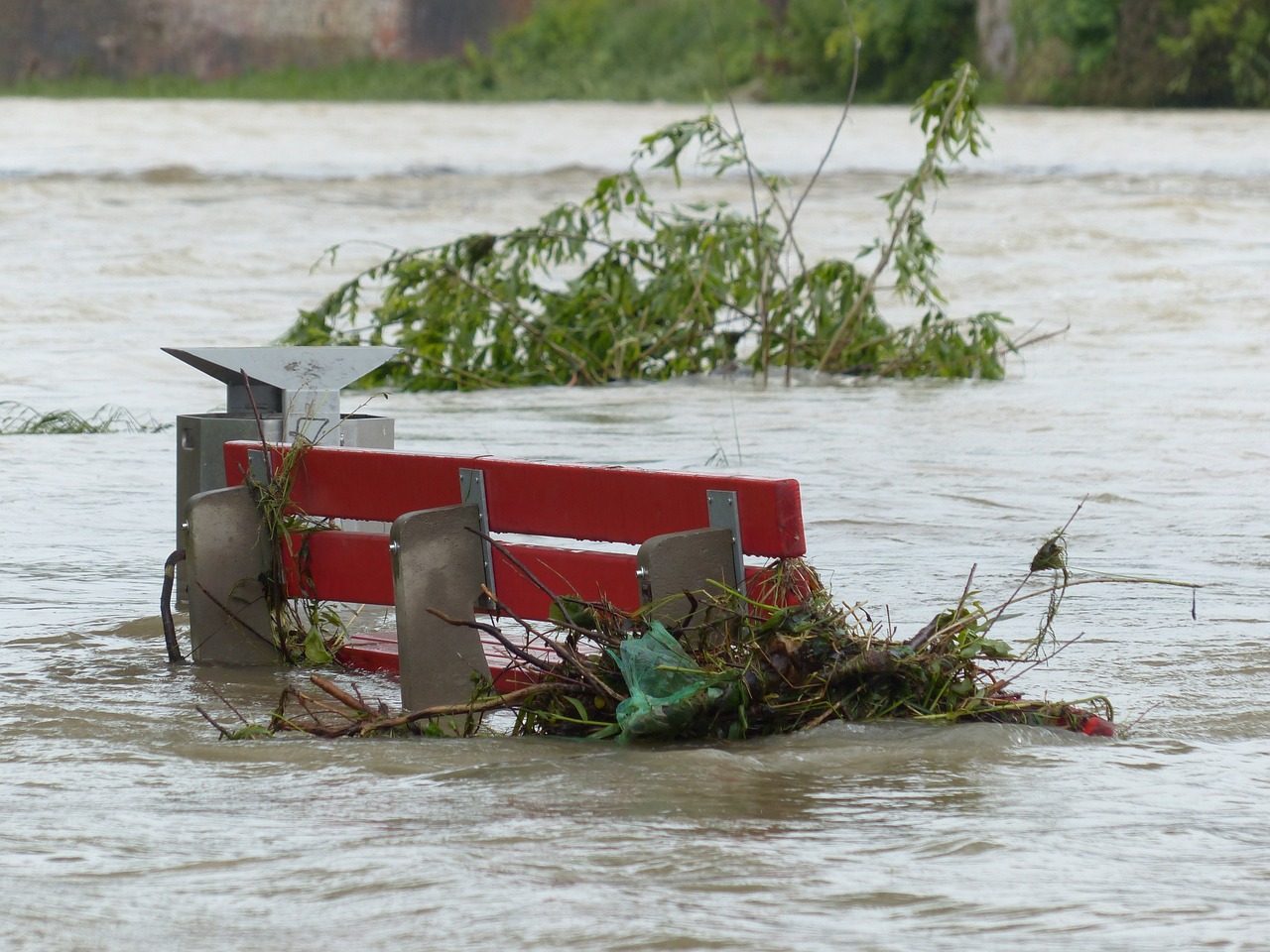 Floods with bench. The climate emergency is causing concern with political leaders.