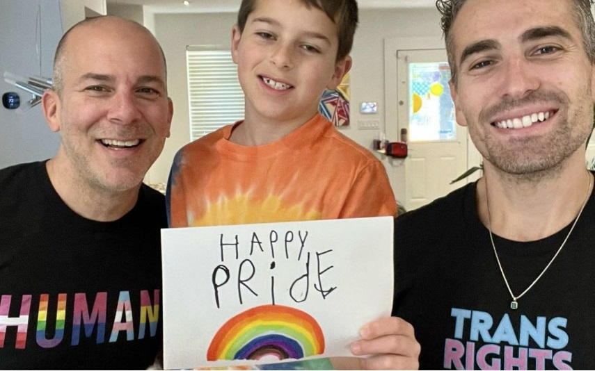 Mr Nelson and Mr Barone with their son Milo with Pride message. Credit: Instagram