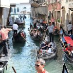 Jam of gondolas in Venice. To combat crowds, a trial of the Venice ticket system will start in 2024.