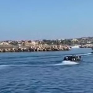 Lampedusa migrant boat procession