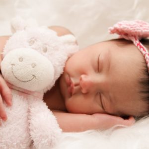 Baby girl with a plush toy. Photo by Ivone De Melo: https://www.pexels.com/photo/baby-sleeping-with-animal-plush-toy-2797865/ Italy's birth rate continues to decline.