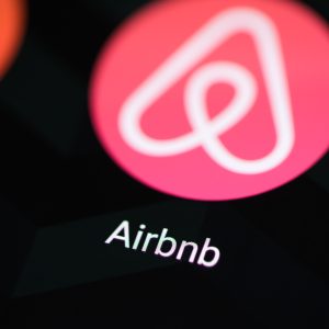 Airbnb logo on smartphone screen. Image: https://www.flickr.com/photos/26344495@N05/