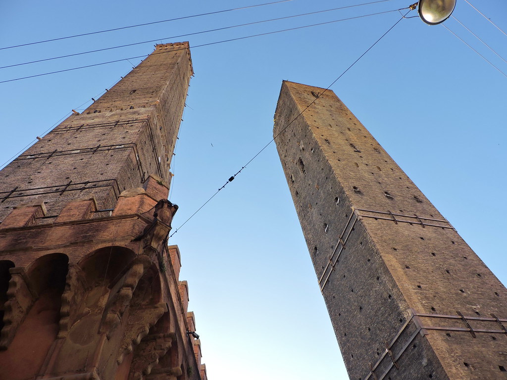 Two towers in Bologna. The leaning tower now has a precarious tilt Creator Dimitris Kamaras via Flickr