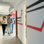 Students walking through school Photo by cottonbro studio: https://www.pexels.com/photo/students-walking-in-the-hallway-6209356/