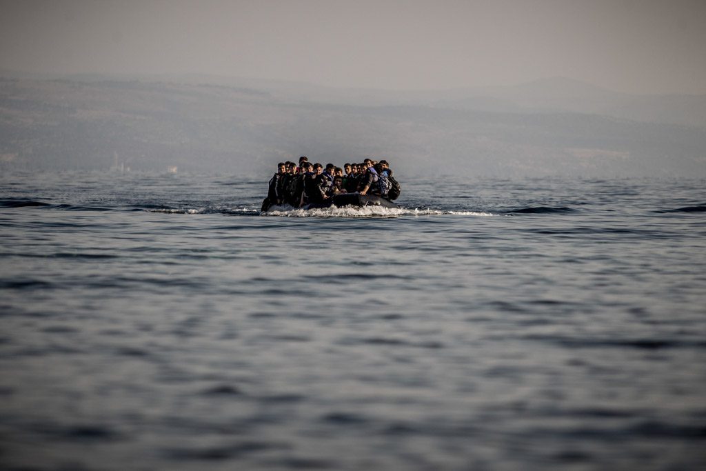 Migrants in a small boat on the sea Copyright: Sandor Csudai