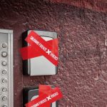 Stickers on self check-in keyboxes in Florence. The boxes will no longer be allowed as self-check-in is now prohibited.