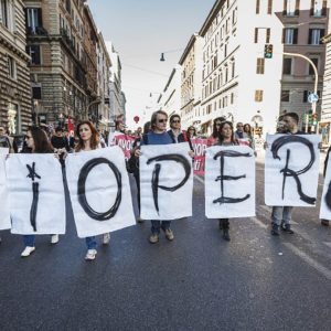 Banner saying strike in Italian. 15 more strikes are planned in December Multi sector strikes scheduled for 27 March 2026