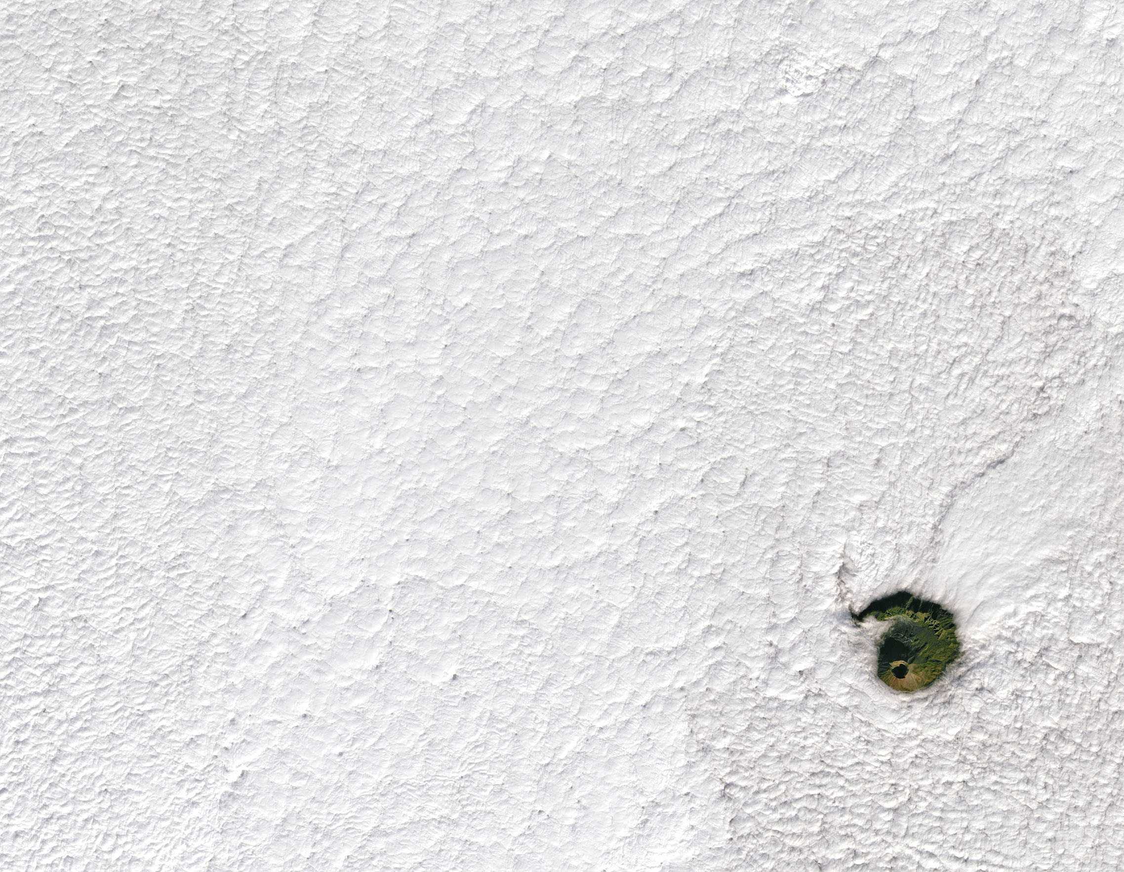 Vesuvius peeks through the couds. (Image credit: NASA/Landsat/Joshua Stevens)