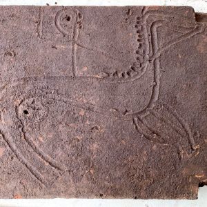 Engraved tile found covering tomb 64, thought to be anccient warrior's tomb