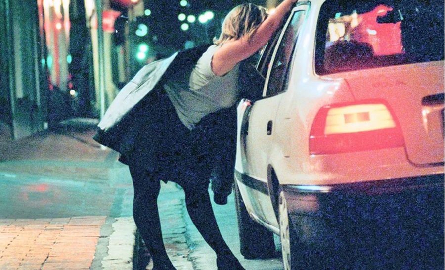prostitution now has economic classification by Italian statistics service. Image shows women talking at car window