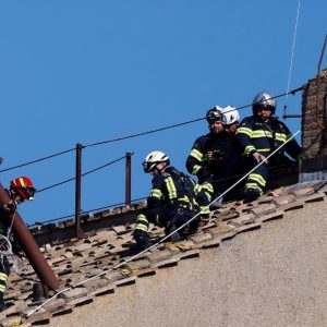 Firefighters install chimney which will signal the election of the new pope. Image credit: Mario Tama/Getty Images