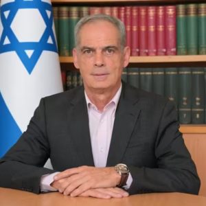 Israeli ambassador to Italy summoned to Foreign Office after Carabinieri threatened on official duty in West Bank. Image shows Jonathan Peled istting in frontt of a bookcase.