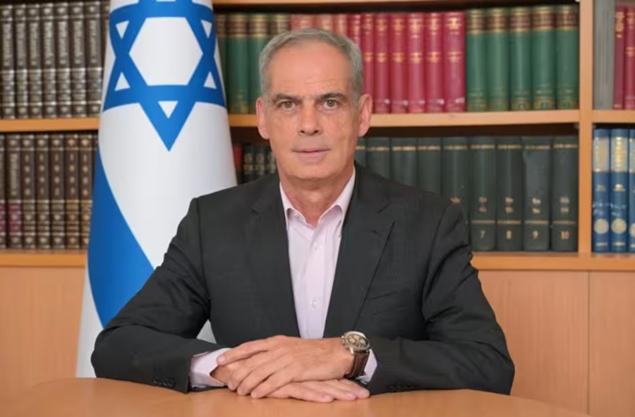 Israeli ambassador to Italy summoned to Foreign Office after Carabinieri threatened on official duty in West Bank. Image shows Jonathan Peled istting in frontt of a bookcase.