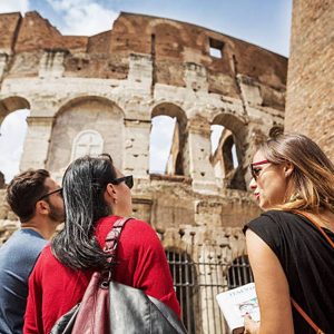 Tour Guide outside the Colosseum in Rome. Image credit: Istock