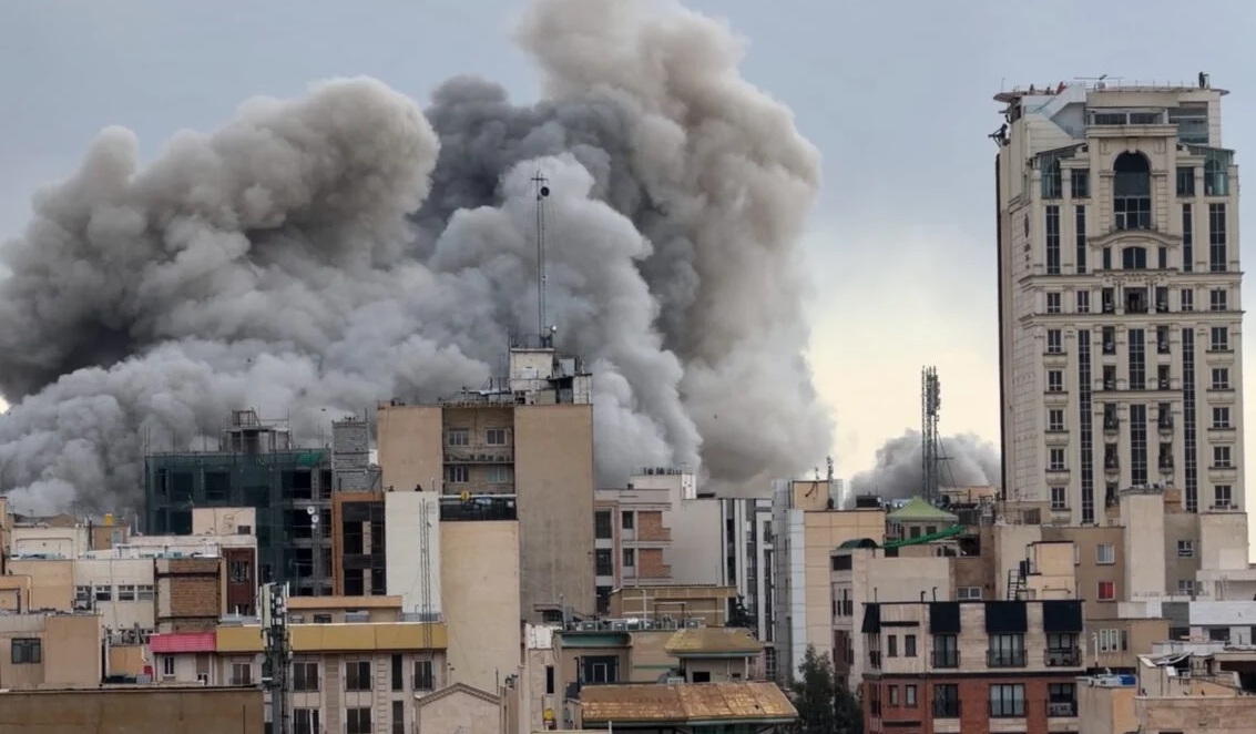 Tajani calls for unity at home as US and Israel continue to hit Tehran. Image shows plume of smoke after strike on Tehran. Image credit: AP Photo/Mohsen Ganji