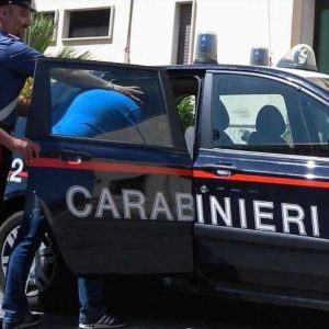 Teen arrested in Perugia accused of planning school massacre. mage shows generic image of Carabinieri arresting someone and putting them in the car.