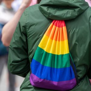 Rainbow backpack. A Torino Pride volunteer was slapped in the face because, they believe, they were wearing a rainbow backpack. Image credit: Istock