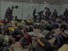 Image shows Global Sumud flotilla activists being forced to kneel whilst restrained.