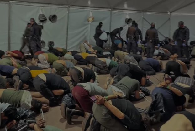 Image shows Global Sumud flotilla activists being forced to kneel whilst restrained.
