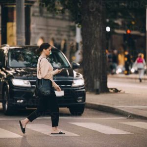 Italy set to fine pedestrians who use phones while crossing the road Pedestrians using phone whilst crossing the road Copyright: © by Westend61 / Maskot,
