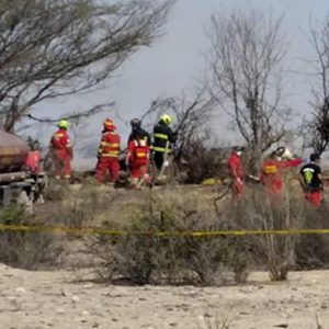 Peru Plane crash - firefighters attend the scene. Image credit: EPA