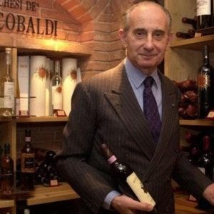 Vittorio Frescobaldi, Tuscan wine patriarch, dies Vittorio Frescobaldi in a wine cellar holding a bottle of red wine